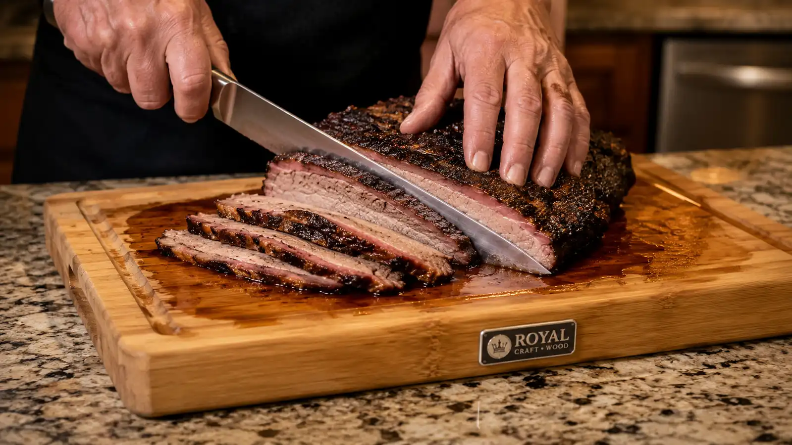 Hands slicing a brisket on a wood carving board with side handles and a deep juice groove catching the drippings